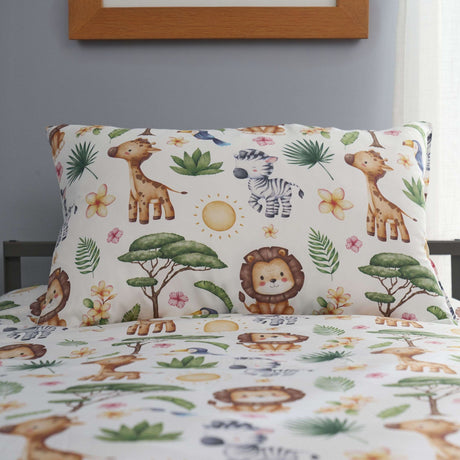 Children's bedding set with safari-themed design featuring animals and plants on a bed.