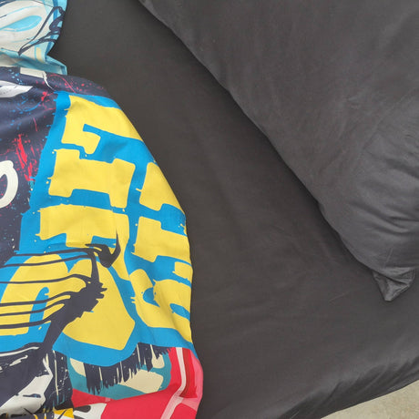 Black sheet set with colourful quilt cover.