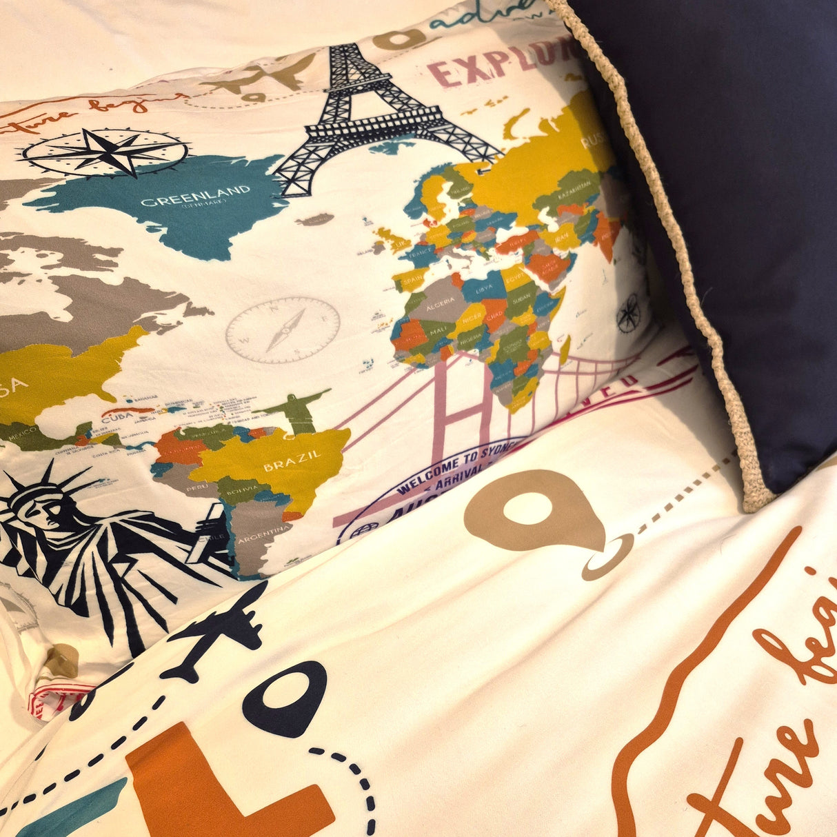 Pillows with world map and landmarks design