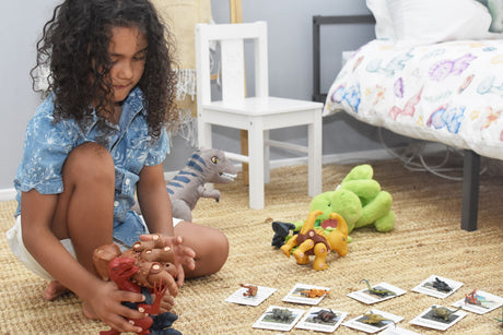 Child Playing With Dinosaur 