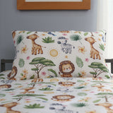Children's bedding set with safari-themed design featuring animals and plants on a bed.