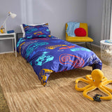 Bedroom with colorful gaming themed bedding, a yellow chair, and plush toy on the floor.