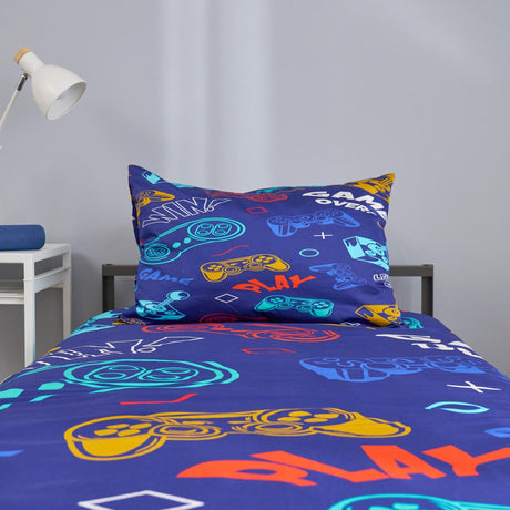 Bedding set with colorful game-themed design on a bed in a room.